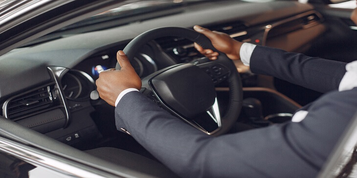 chauffeur holding the steering wheel