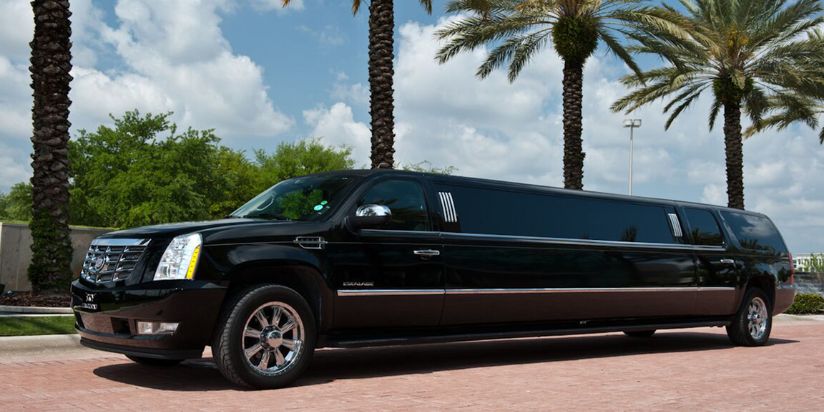 The suv limo is parked to a beautiful place